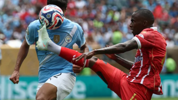 Manchester City’s Vitor Reis tries to get the ball off Wydad Casablanca’s Thembinkosi Lorch (right). Photo: AFP Image: AFP Manchester City’s Vitor Reis tries to get the ball off Wydad Casablanca’s Thembinkosi Lorch (right). Photo: AFP Image: AFP